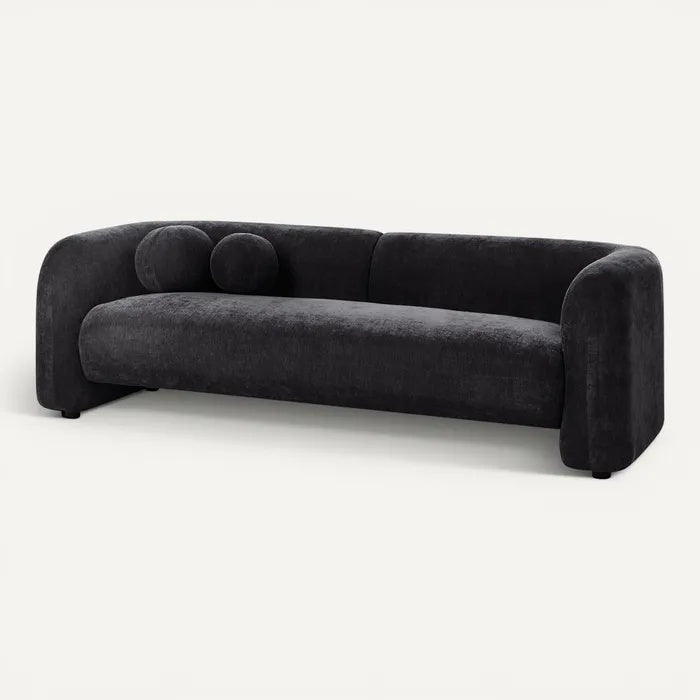 **Luxe zwarte bank met afgeronde hoeken en kussens**